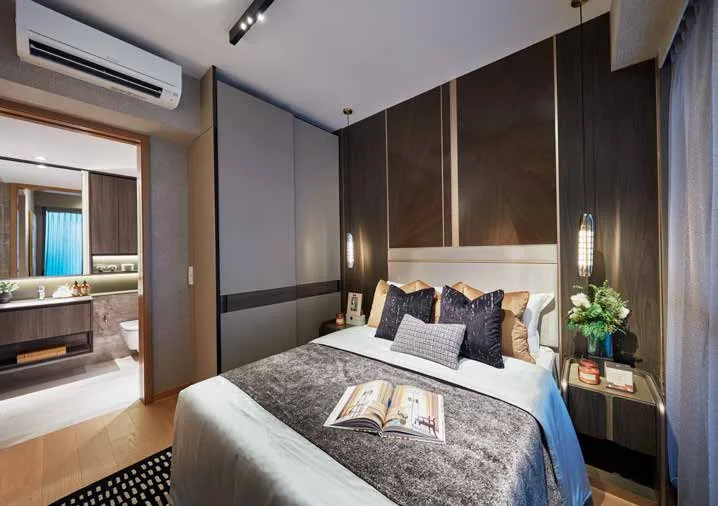 Kassia show-unit interior, for illustration only: a master bedroom with a padded headboard, timber panelling and a wall-mounted air-conditioner